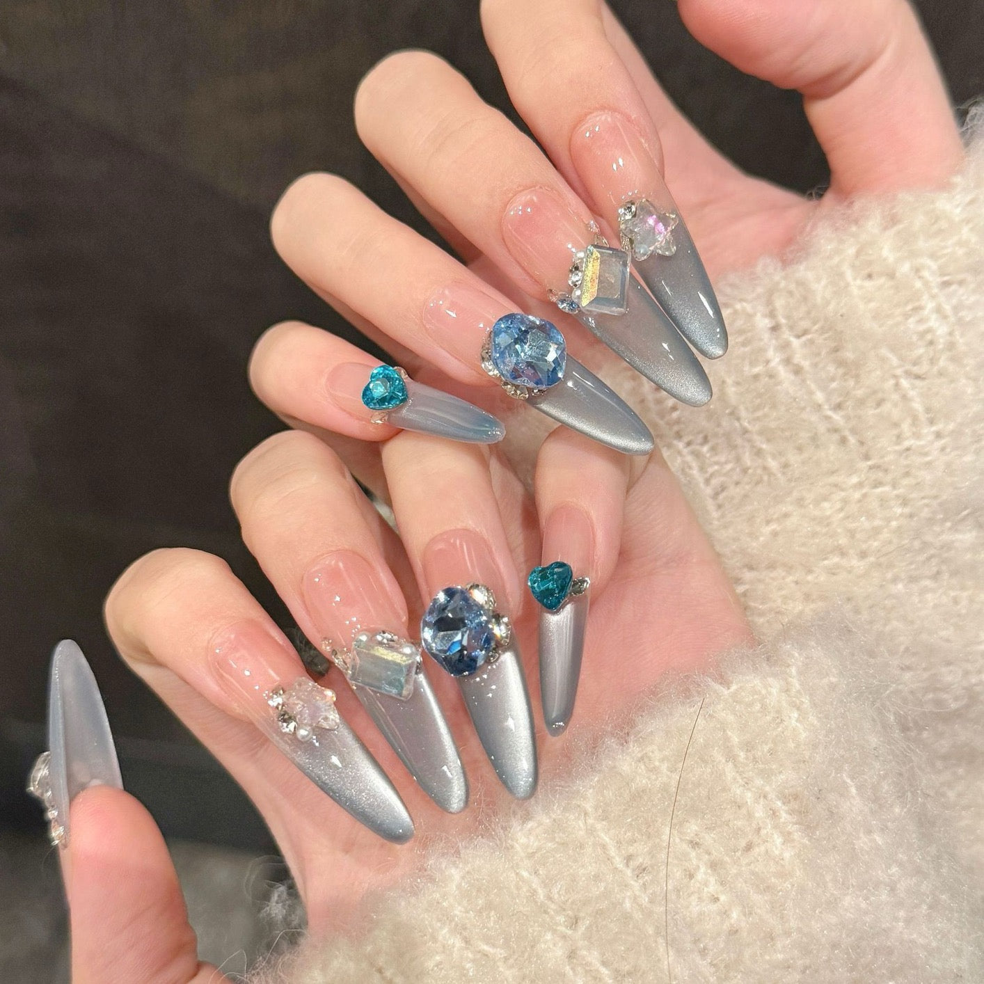 Aquamarine French gradient side-light cat's eye small diamond sparkly blue Danube light therapy wearing nail polish