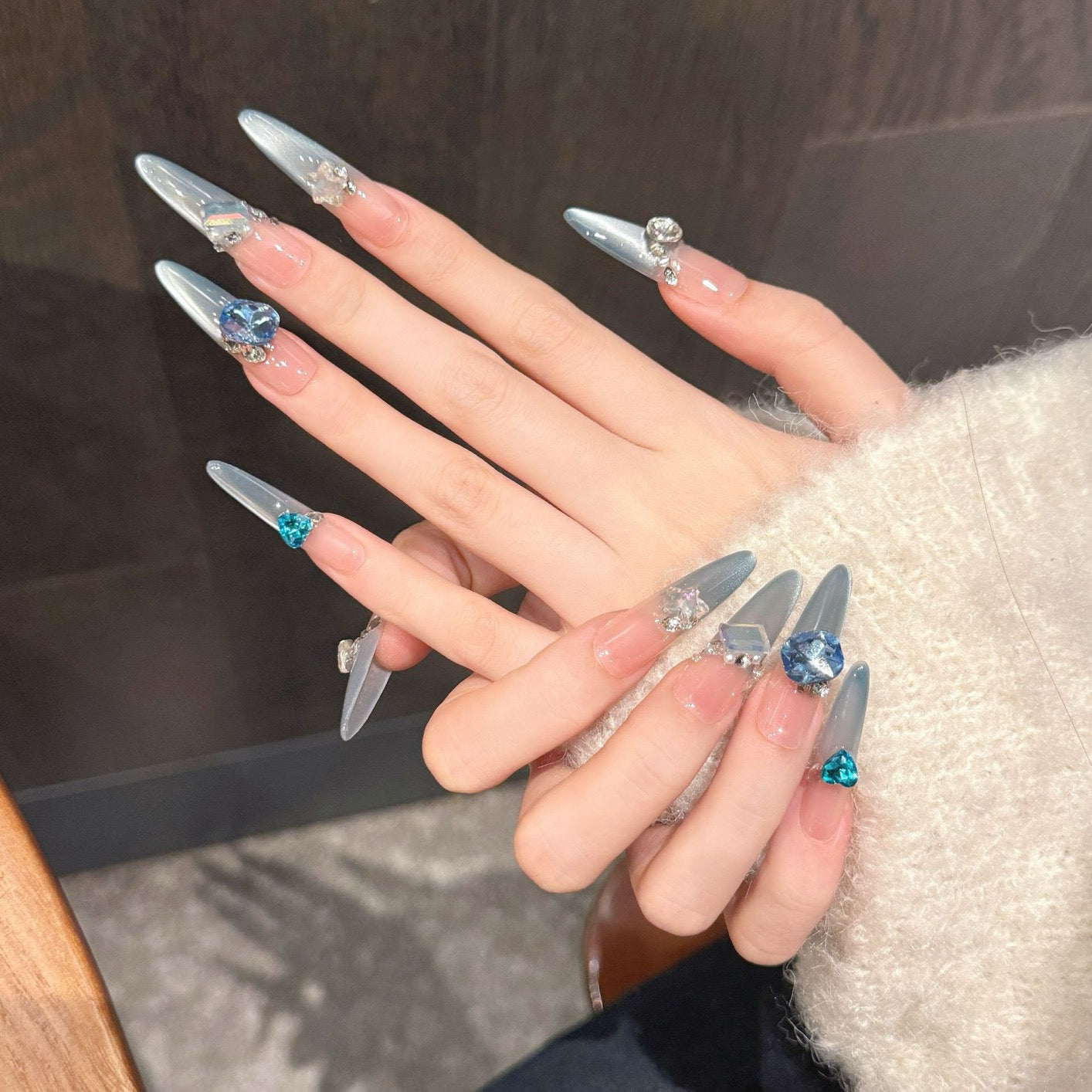 Aquamarine French gradient side-light cat's eye small diamond sparkly blue Danube light therapy wearing nail polish