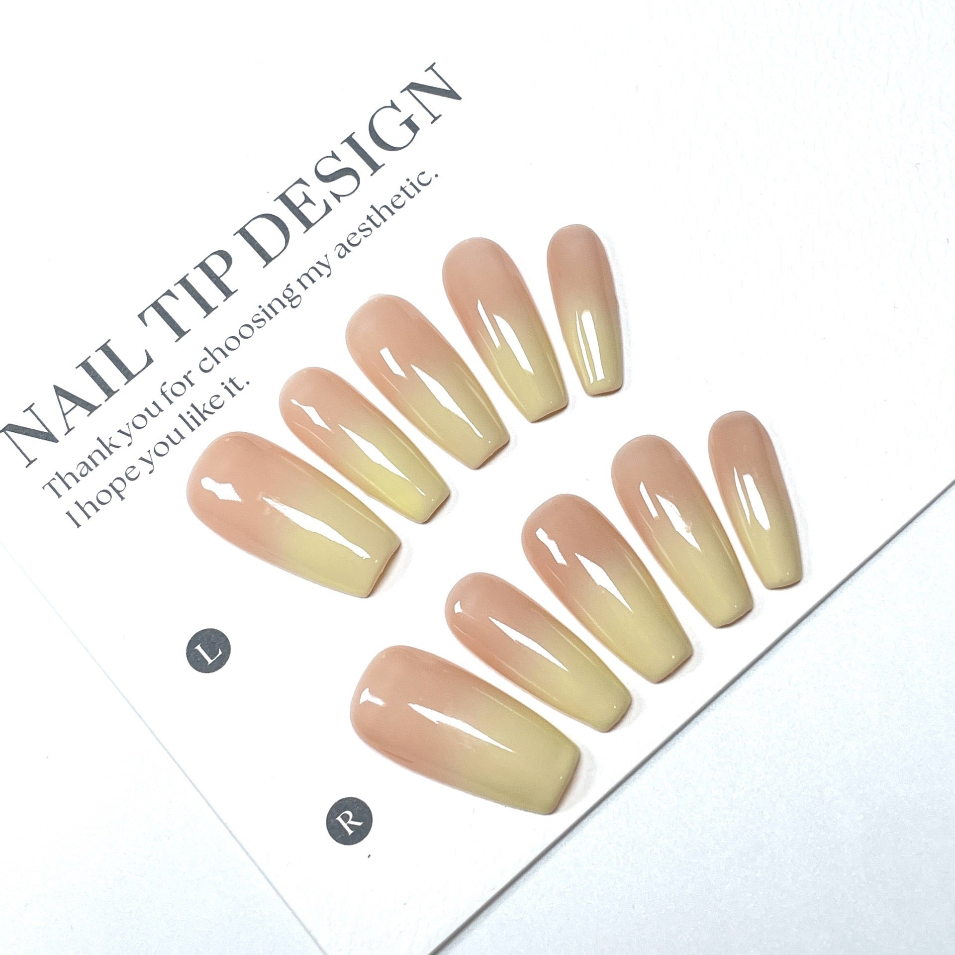 High-quality handmade eco-friendly nail art with faux nails for autumn and winter. Soft peach-yellow gradient blush with a cozy atmosphere.