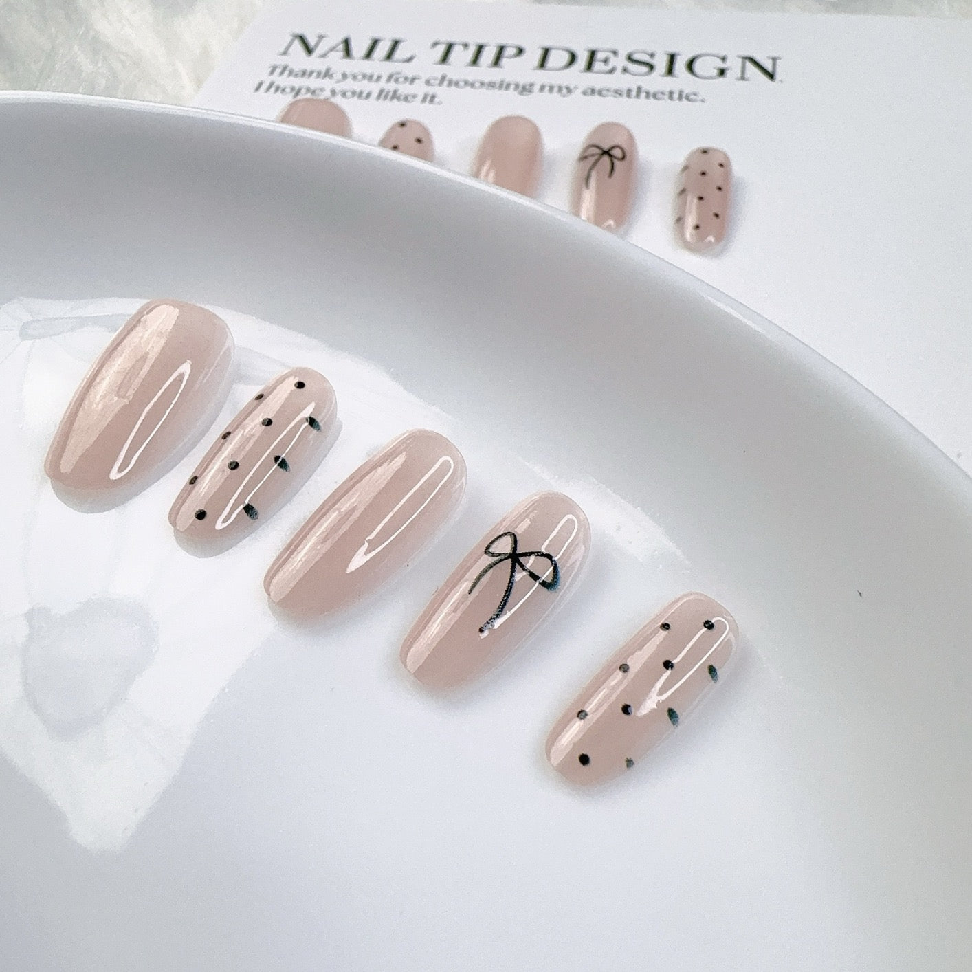 Pre-designed press-on nail tips featuring handmade airbrushed gel polish in elegant French gradients, soft blush tones, and classic solid colors. Ideal as semi-finished nail art bases for quick salon-style looks.