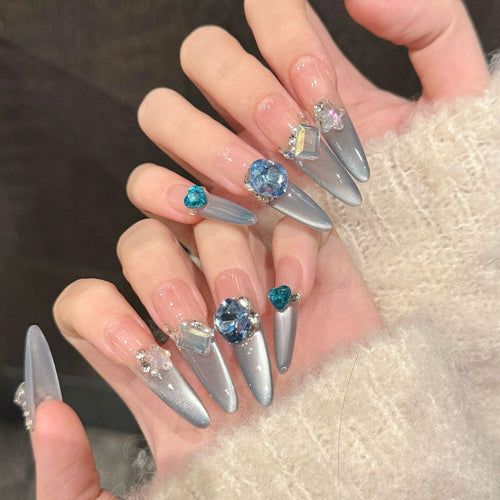 Aquamarine French gradient side-light cat's eye small diamond sparkly blue Danube light therapy wearing nail polish