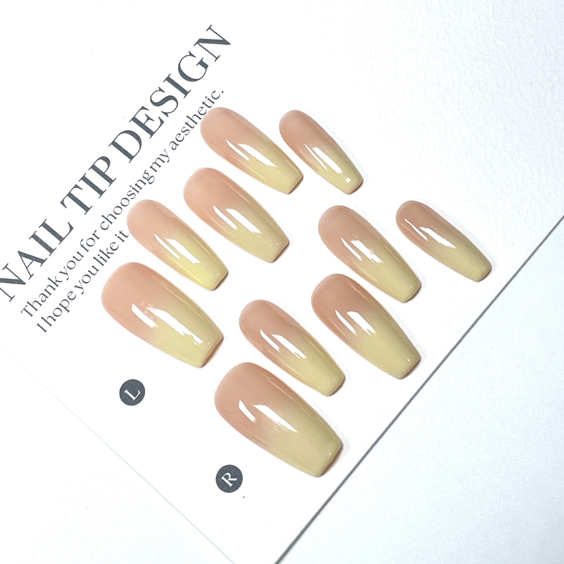 High-quality handmade eco-friendly nail art with faux nails for autumn and winter. Soft peach-yellow gradient blush with a cozy atmosphere.