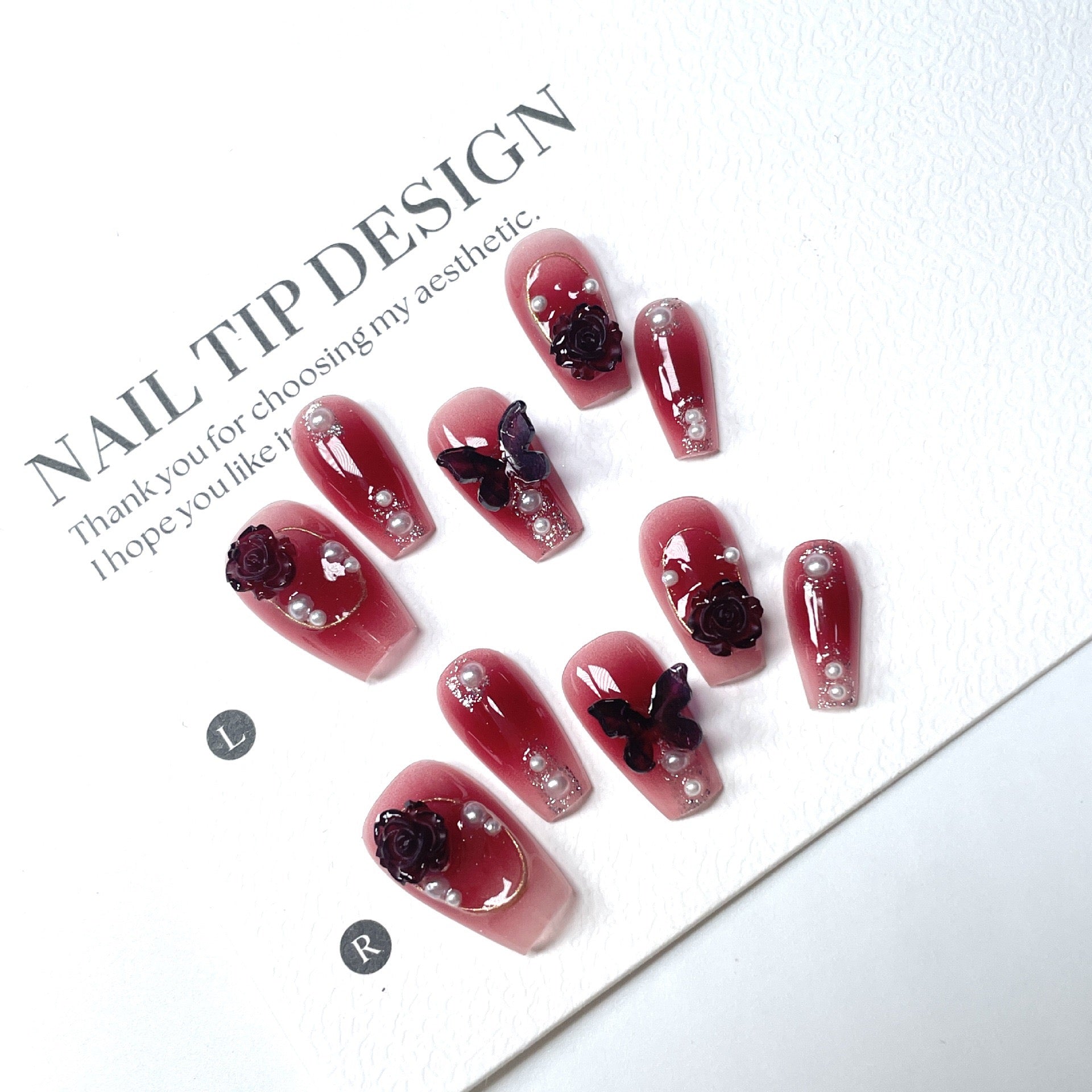 Dark red butterfly-shaped nail decorations for 2025 new style. Complementary accessories made of pure handcrafted materials. Environmentally friendly. Easy to wear. Suitable for parties and daily outings.