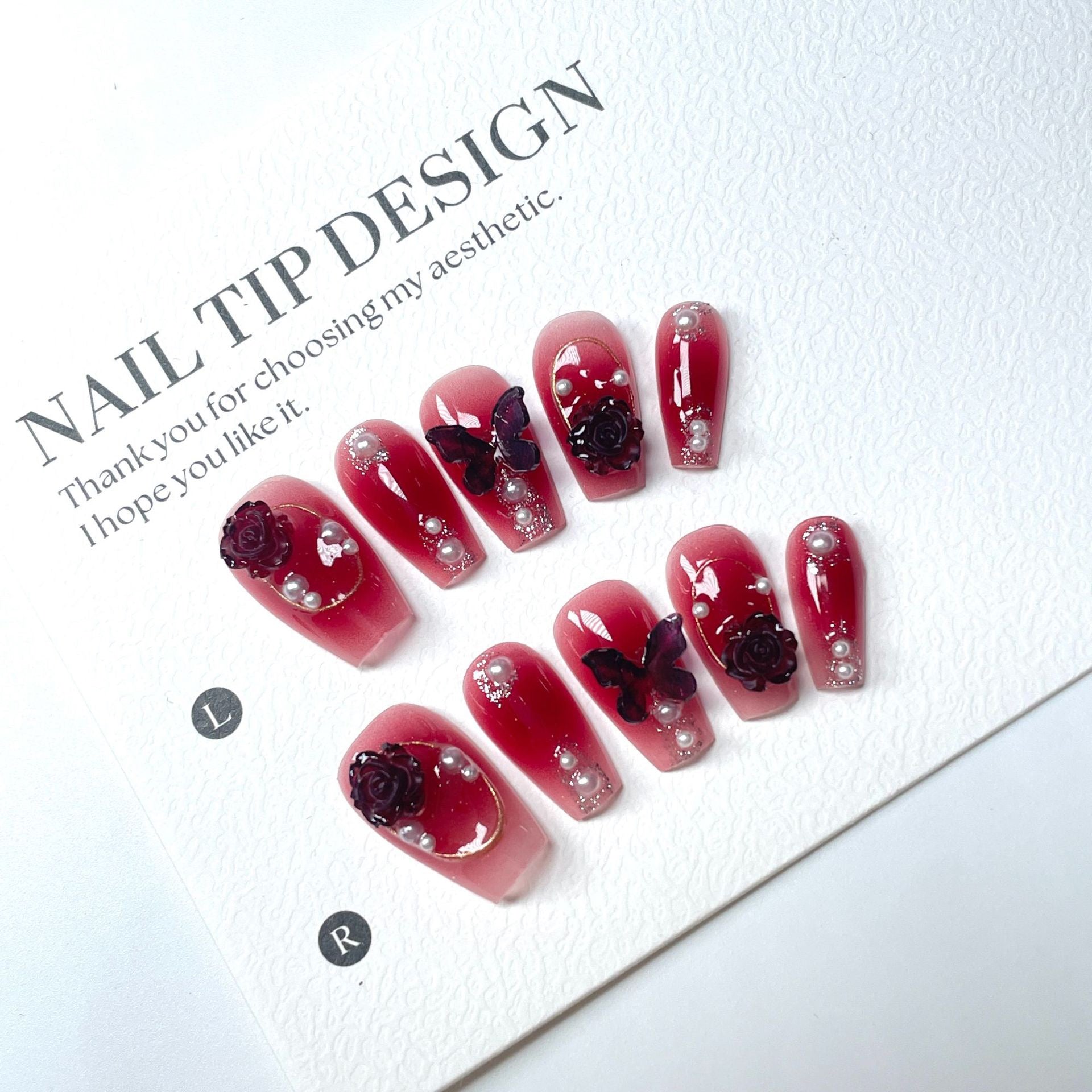 Dark red butterfly-shaped nail decorations for 2025 new style. Complementary accessories made of pure handcrafted materials. Environmentally friendly. Easy to wear. Suitable for parties and daily outings.